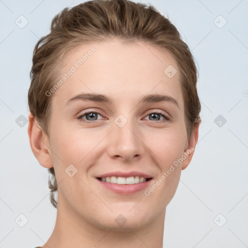 Joyful white young-adult female with short  brown hair and grey eyes