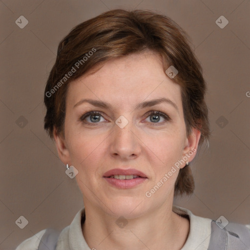 Joyful white adult female with short  brown hair and grey eyes