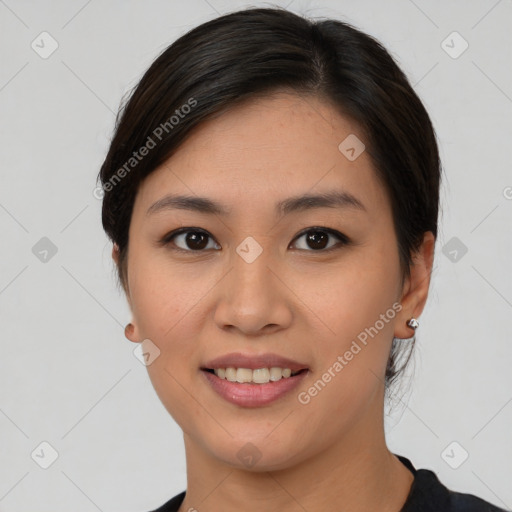 Joyful asian young-adult female with short  brown hair and brown eyes