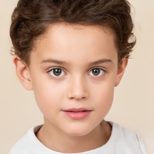 Joyful white child female with short  brown hair and brown eyes