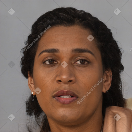 Joyful black adult female with short  brown hair and brown eyes