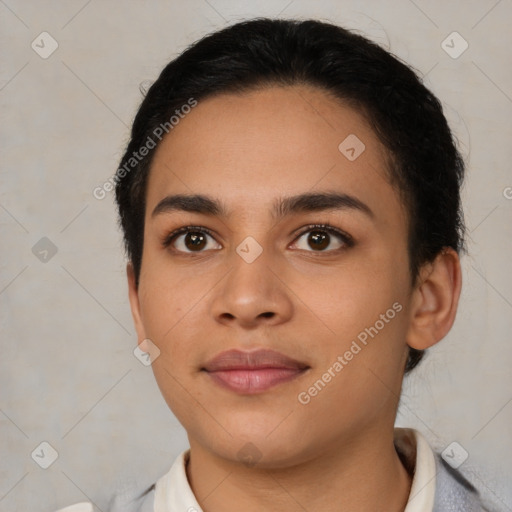 Joyful latino young-adult female with short  black hair and brown eyes