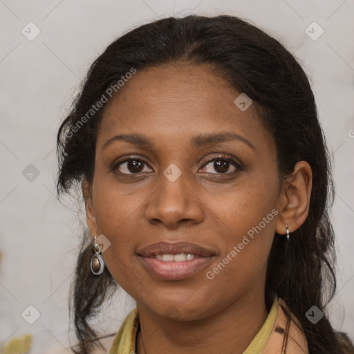 Joyful black adult female with medium  brown hair and brown eyes