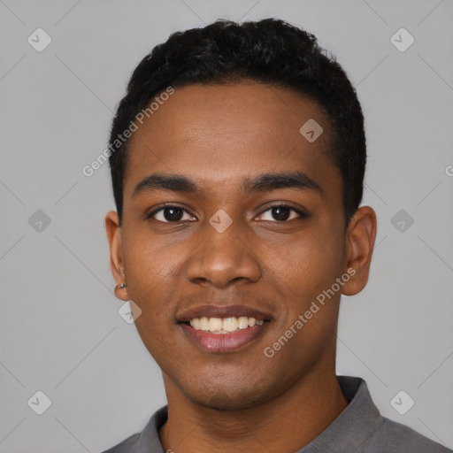 Joyful black young-adult male with short  black hair and brown eyes