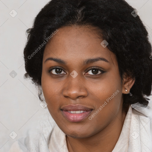 Joyful black young-adult female with medium  black hair and brown eyes