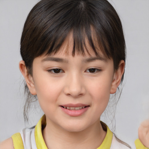 Joyful asian child female with medium  brown hair and brown eyes