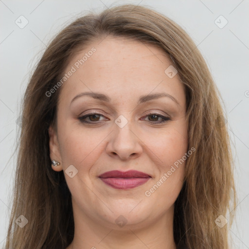 Joyful white adult female with long  brown hair and brown eyes