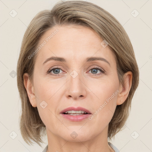 Joyful white adult female with medium  brown hair and grey eyes