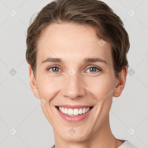 Joyful white young-adult female with short  brown hair and grey eyes