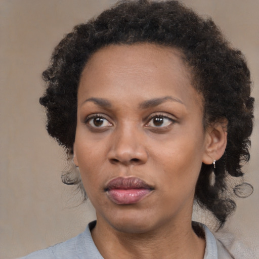 Neutral black adult female with medium  black hair and brown eyes