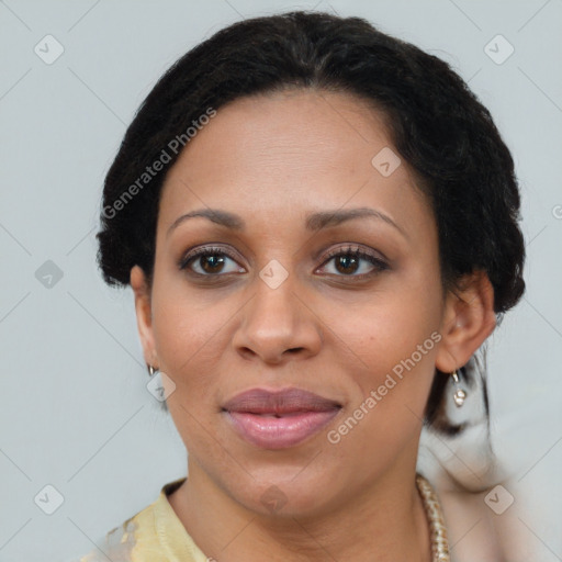 Joyful latino adult female with medium  brown hair and brown eyes