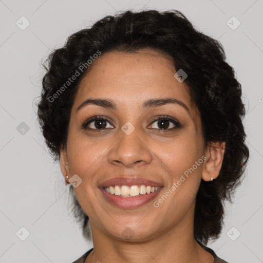 Joyful latino young-adult female with short  brown hair and brown eyes