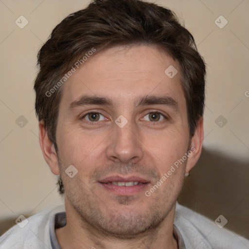 Joyful white adult male with short  brown hair and brown eyes