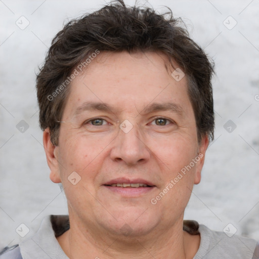 Joyful white adult male with short  brown hair and grey eyes