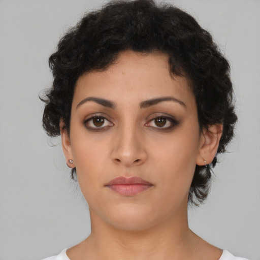 Neutral latino young-adult female with medium  brown hair and brown eyes