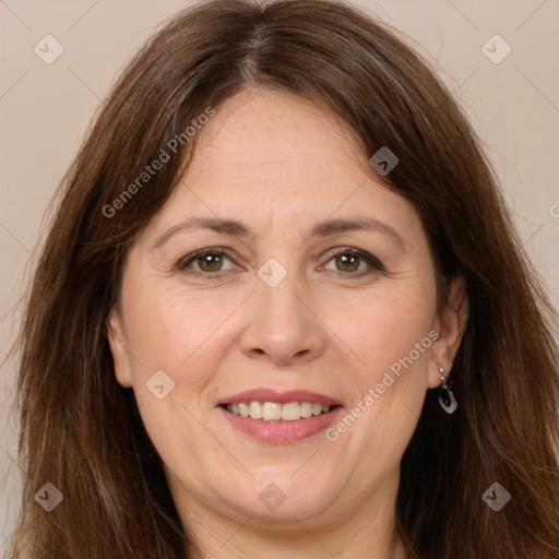 Joyful white adult female with long  brown hair and brown eyes