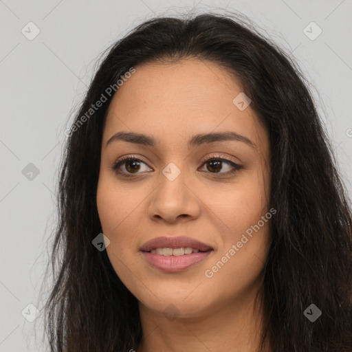 Joyful latino young-adult female with long  brown hair and brown eyes