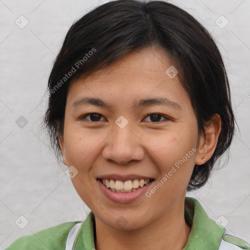 Joyful asian young-adult female with short  brown hair and brown eyes