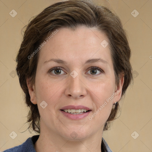 Joyful white adult female with medium  brown hair and grey eyes