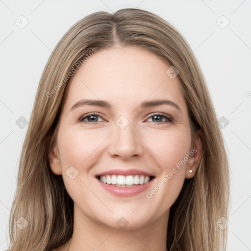 Joyful white young-adult female with long  brown hair and grey eyes