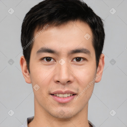 Joyful asian young-adult male with short  brown hair and brown eyes