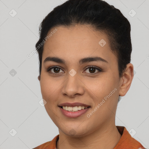 Joyful white young-adult female with short  black hair and brown eyes