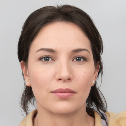 Neutral white young-adult female with medium  brown hair and brown eyes