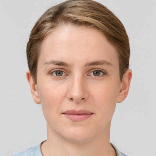 Joyful white young-adult female with short  brown hair and grey eyes