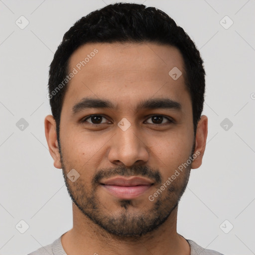 Joyful latino young-adult male with short  black hair and brown eyes