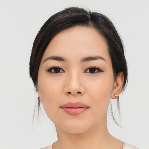Joyful asian young-adult female with medium  black hair and brown eyes