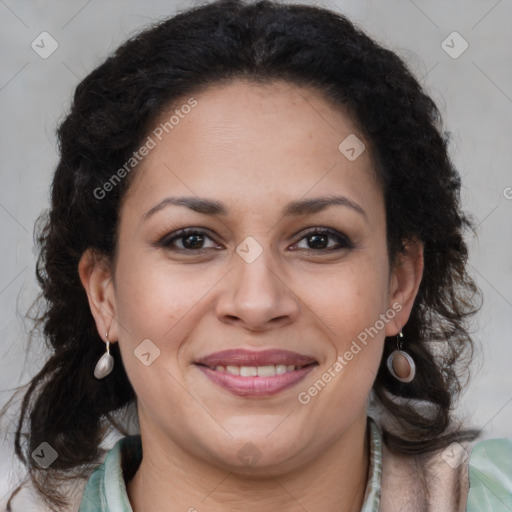 Joyful black adult female with long  brown hair and brown eyes