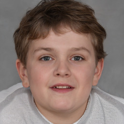 Joyful white child male with short  brown hair and brown eyes