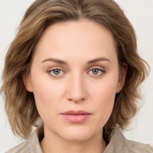 Neutral white young-adult female with medium  brown hair and green eyes