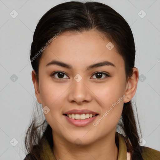 Joyful latino young-adult female with long  brown hair and brown eyes