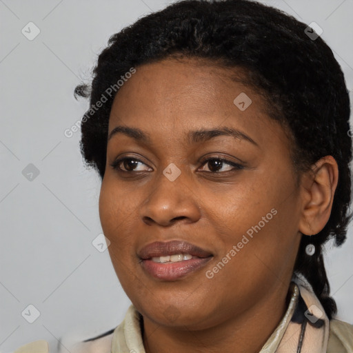 Joyful black young-adult female with medium  black hair and brown eyes