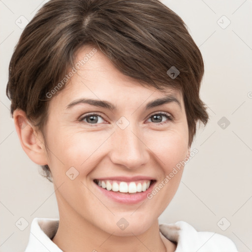 Joyful white young-adult female with short  brown hair and grey eyes