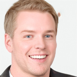 Joyful white young-adult male with short  brown hair and blue eyes