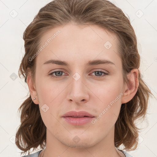 Joyful white young-adult female with medium  brown hair and blue eyes