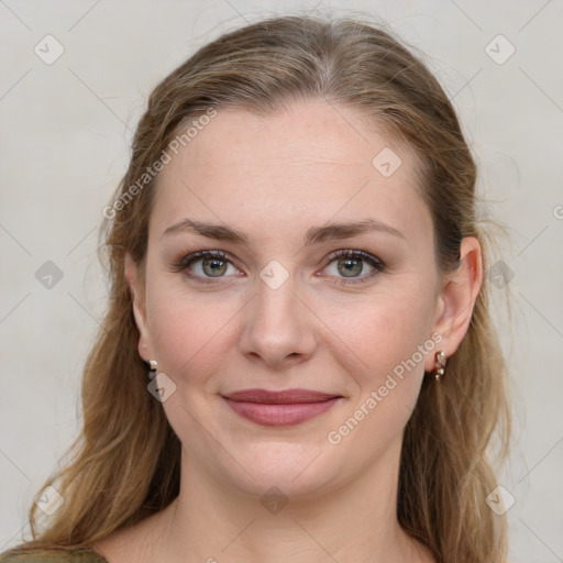 Joyful white young-adult female with medium  brown hair and blue eyes