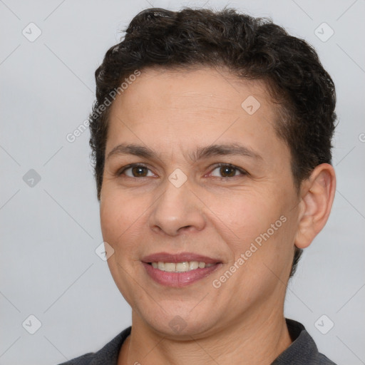 Joyful white adult female with short  brown hair and brown eyes