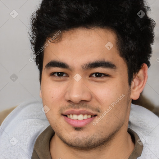 Joyful latino young-adult male with short  brown hair and brown eyes