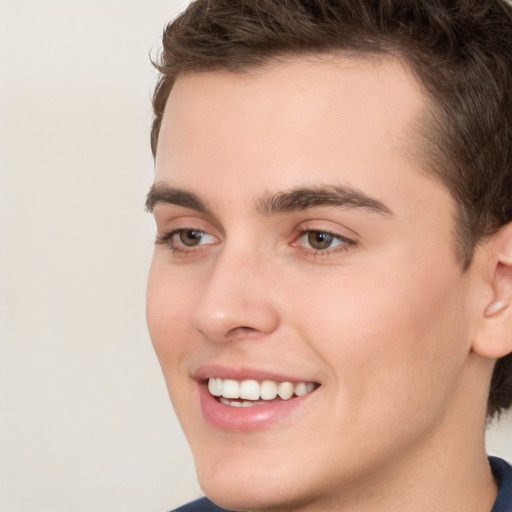 Joyful white young-adult male with medium  brown hair and brown eyes