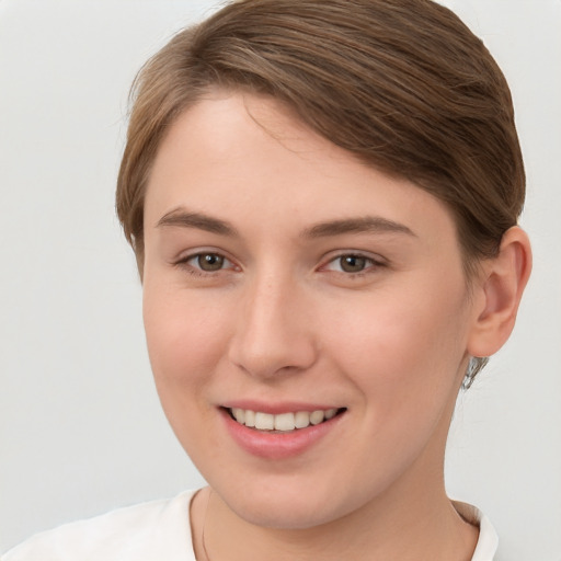 Joyful white young-adult female with short  brown hair and brown eyes