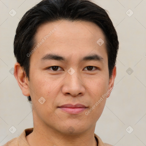 Joyful asian young-adult male with short  brown hair and brown eyes