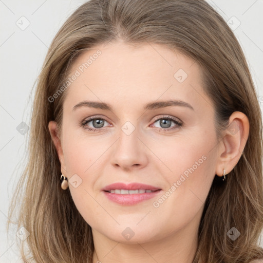 Joyful white young-adult female with long  brown hair and grey eyes