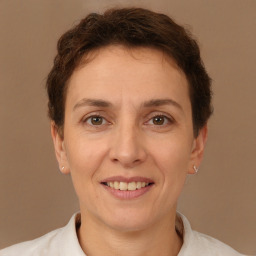 Joyful white adult female with short  brown hair and brown eyes