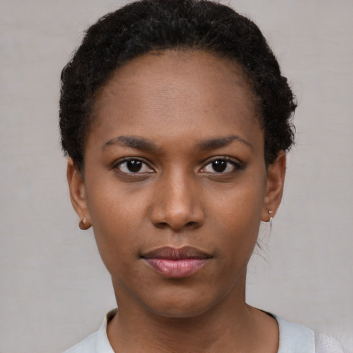 Neutral black young-adult female with short  brown hair and brown eyes