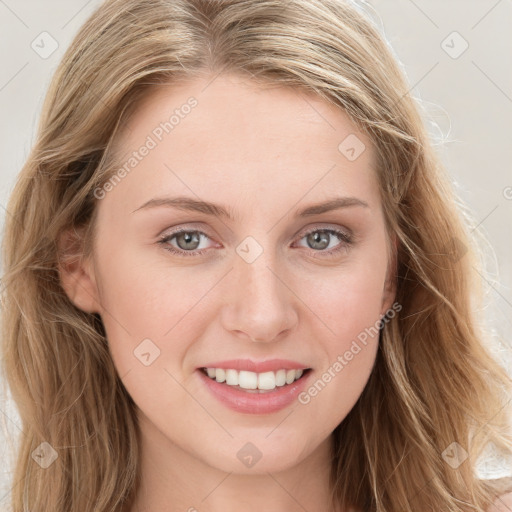 Joyful white young-adult female with long  brown hair and blue eyes