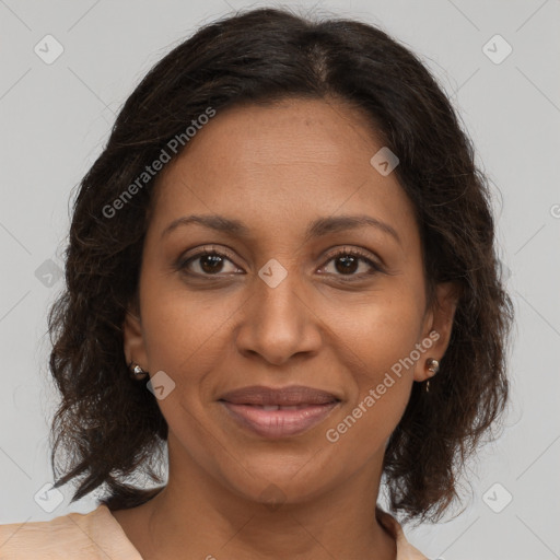 Joyful black adult female with medium  brown hair and brown eyes