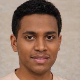 Joyful latino young-adult male with short  brown hair and brown eyes